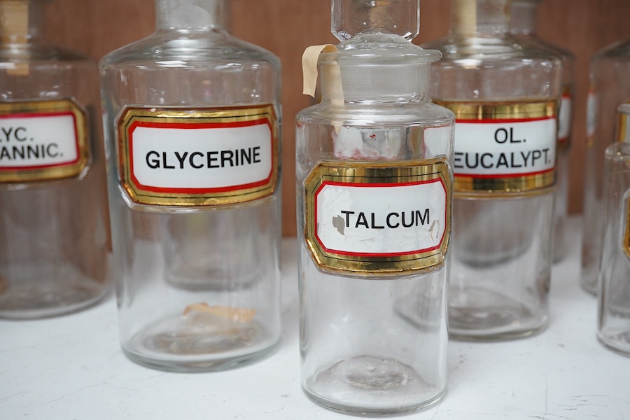 A collection of eleven various sized apothecary labelled bottles, tallest 20cm high. Condition - good